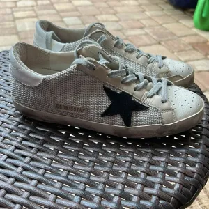 Golden Goose Superstar sneakers  cream with black star with mesh detail.