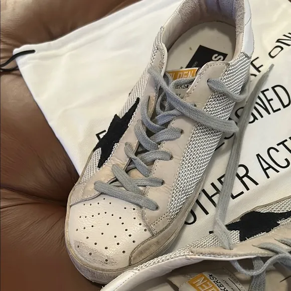 Golden Goose Superstar sneakers  cream with black star with mesh detail.