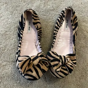 Miu Miu Tiger Print Leather Ballet Flats with Bows